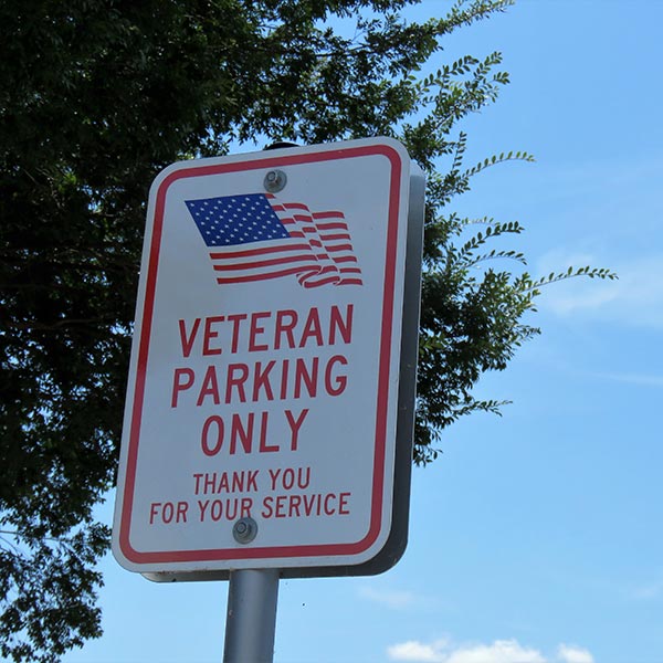 A parking lot sign reading Veteran Parking Only